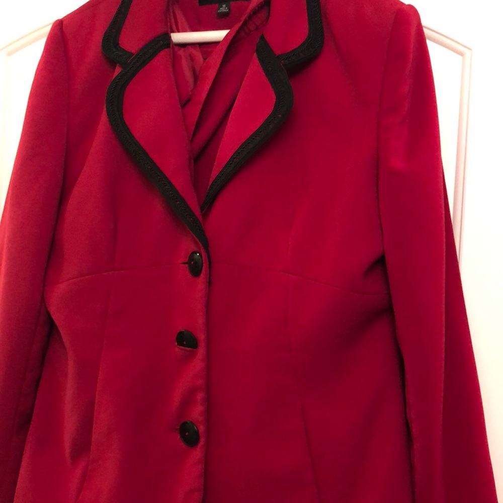 Red skirt suit.  Black trim.